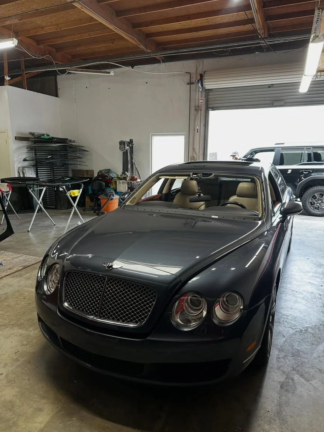 Luxury sedan at an auto glass service appointment