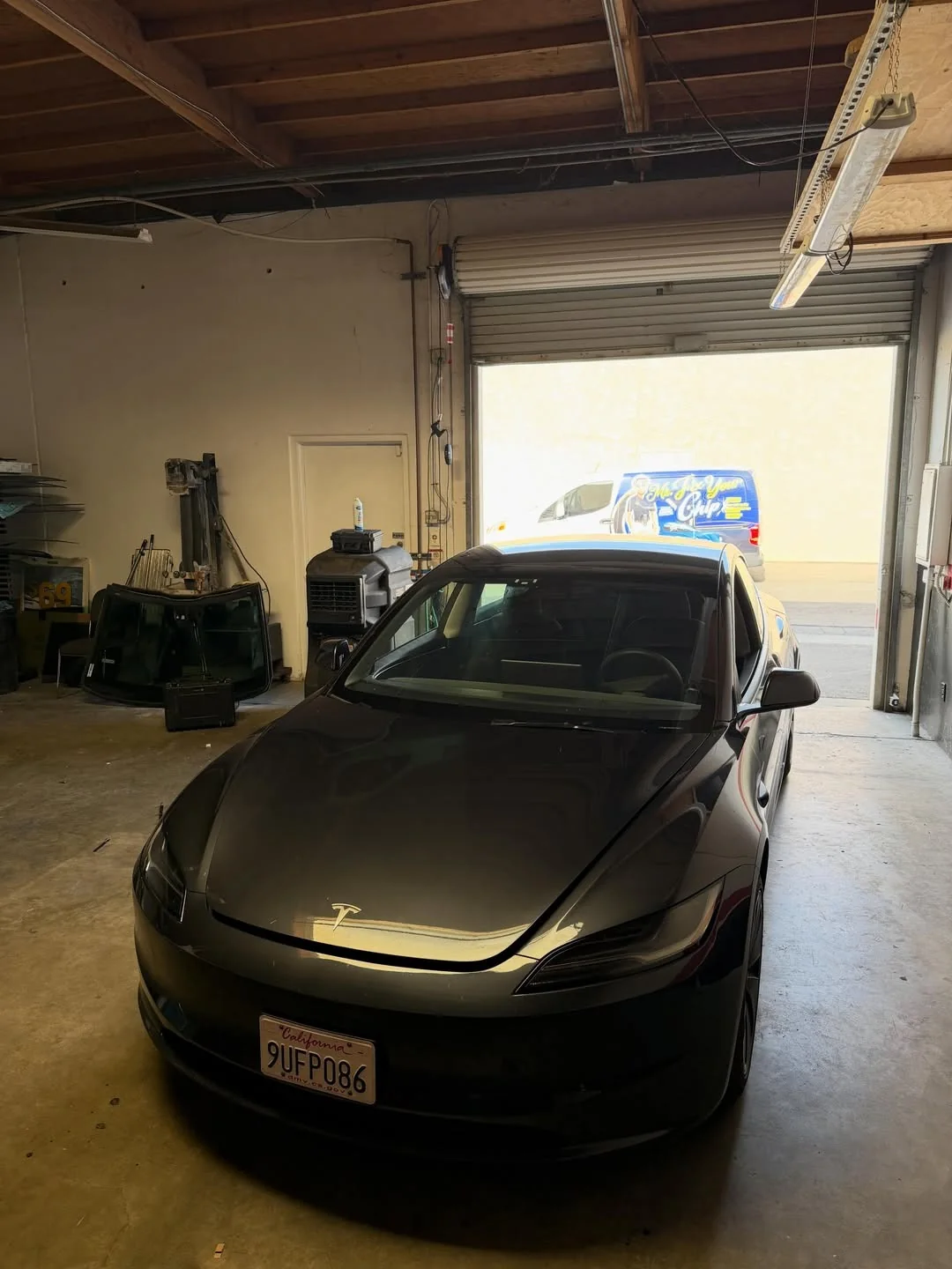 Electric sedan at a windshield service appointment