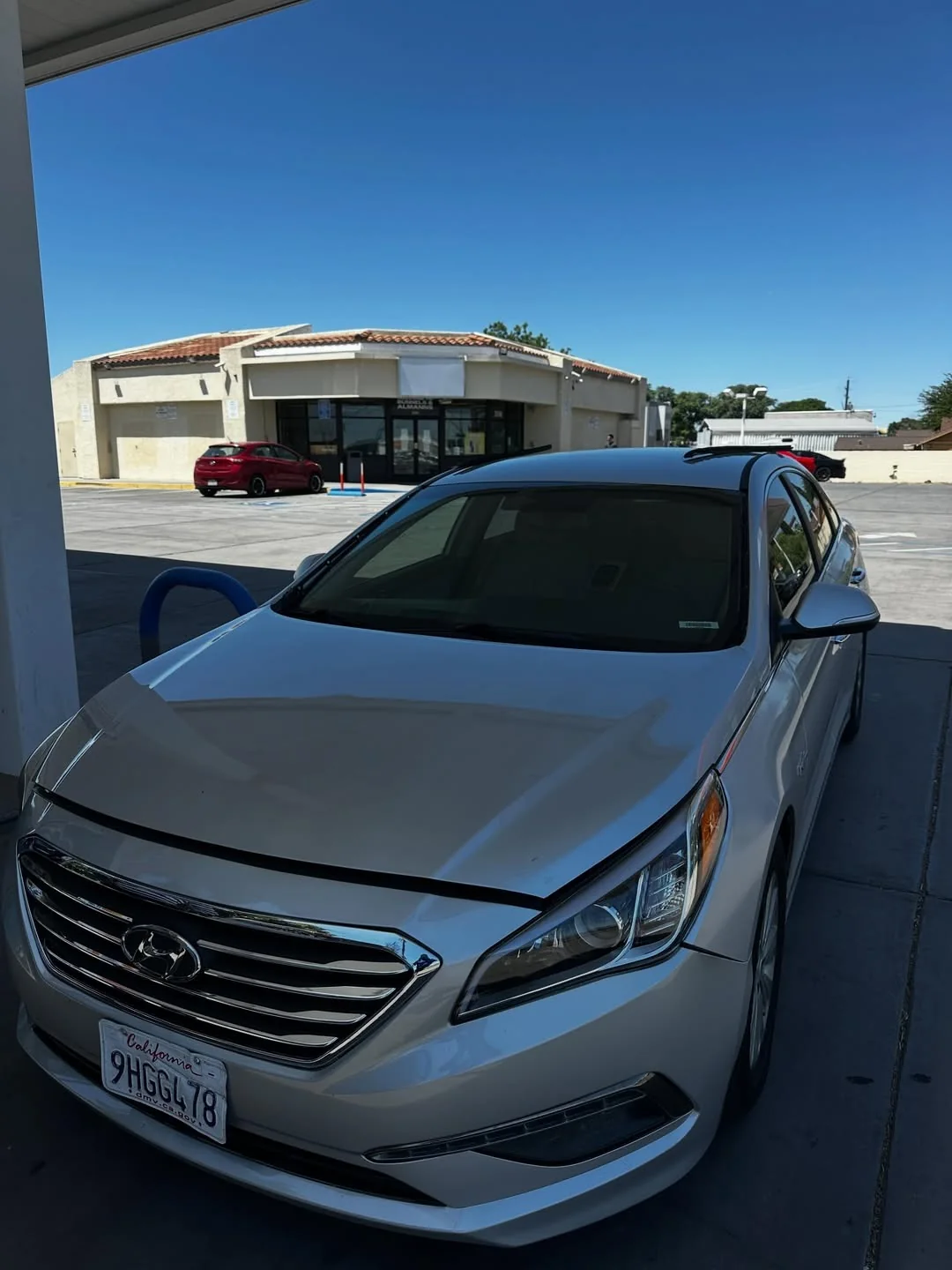 White sedan after windshield service